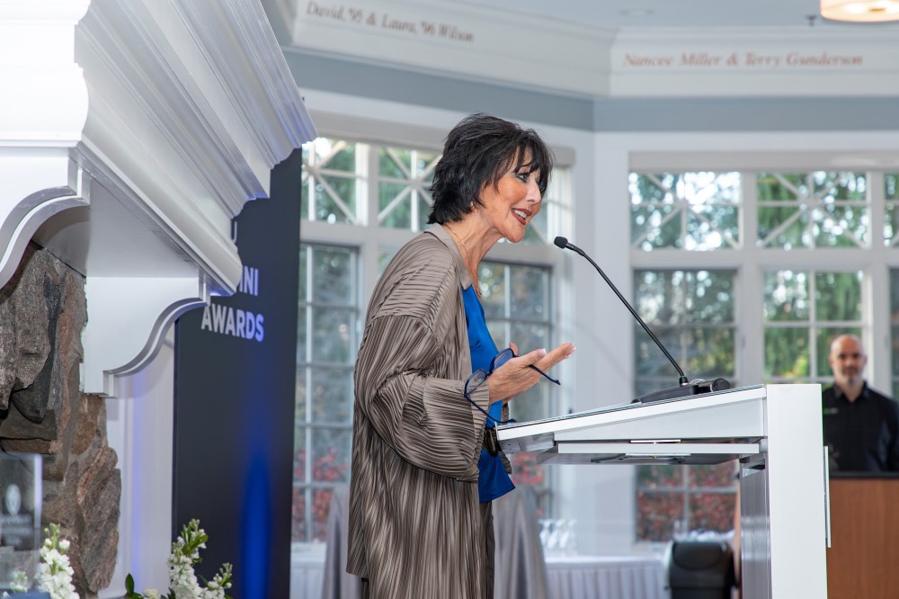 President Mantella speaking into microphone